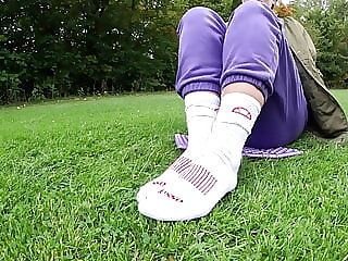 Girl in white socks outdoor..